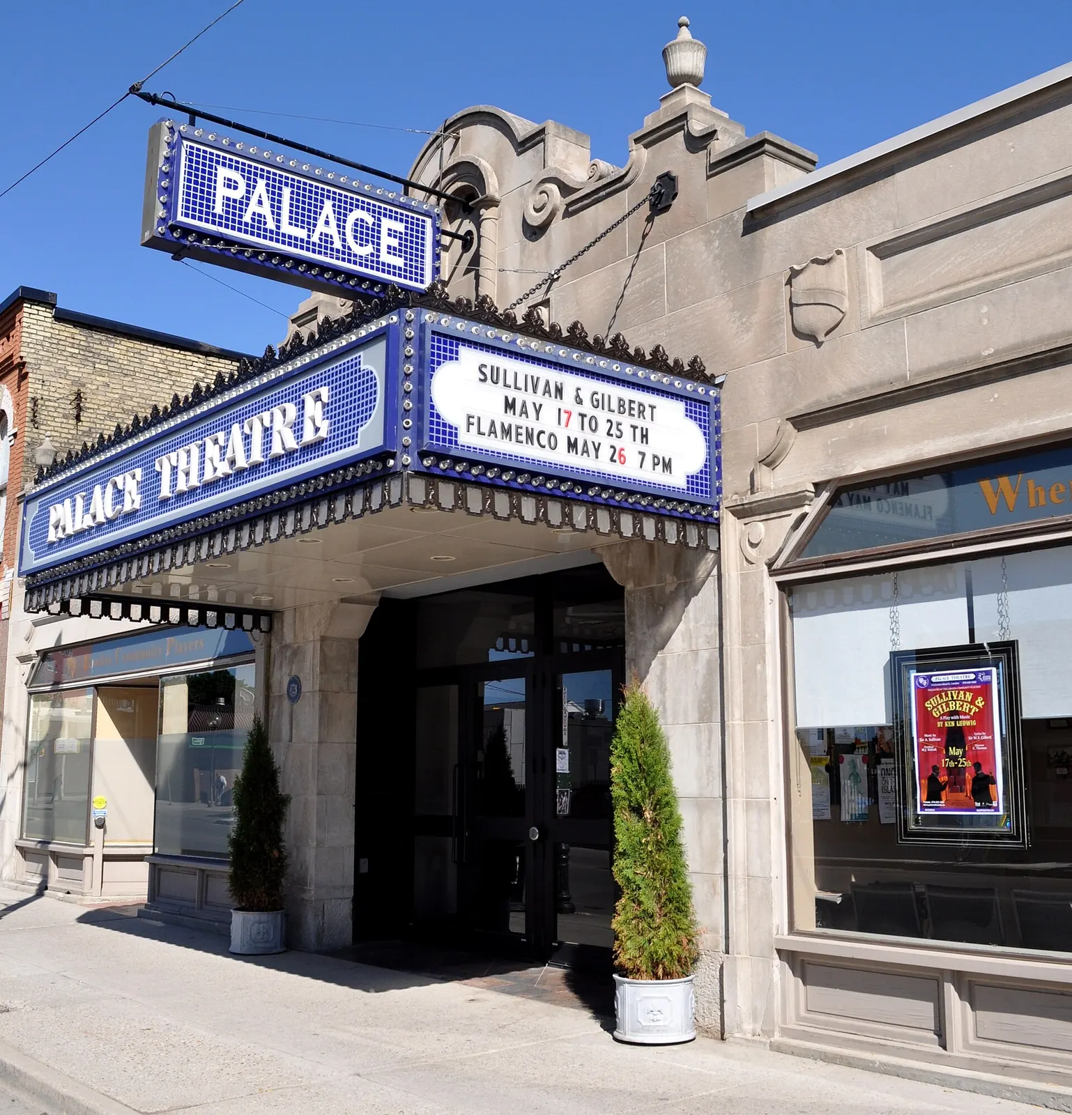 The tiled marquee and stone entrance of the Palace Theatre at 710 Dundas Street, London, Ontario, with a show listing on the reader board.